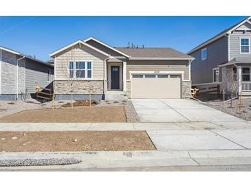 Charming single-Gathering home featuring a two-car garage and stone accents at 24739 E 39Th Ave, Aurora, CO 80019