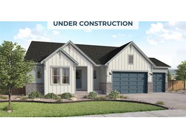 Charming single-Gathering home featuring board and batten siding, gray accents, and a well-manicured front lawn at 428 Clear Bell Ln, Monument, CO 80132
