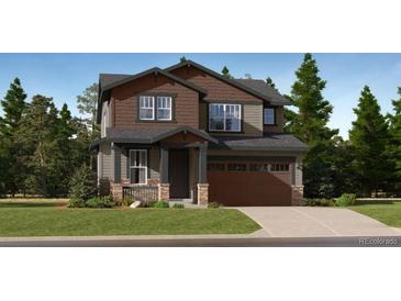 Charming two-story home featuring a two-car garage, well-maintained landscaping, and attractive architectural details at 7735 S Cherokee Trl, Centennial, CO 80016