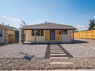 Charming single-story home with a well-maintained yard and inviting entrance at 3110 W 66Th Ave, Denver, CO 80221