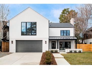 Stunning two-story farmhouse with modern exterior finishes and landscaping at 251 Hudson St, Denver, CO 80220