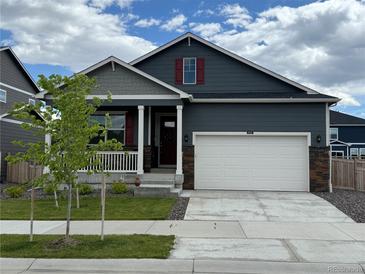 Charming single-Gathering home with a two-car garage and a well-maintained lawn at 4642 Longs Peak St, Brighton, CO 80601