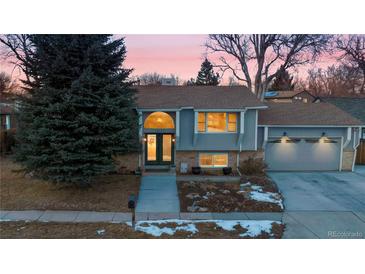 Attractive ranch home with a landscaped yard and attached two-car garage at 11177 W 68Th Pl, Arvada, CO 80004