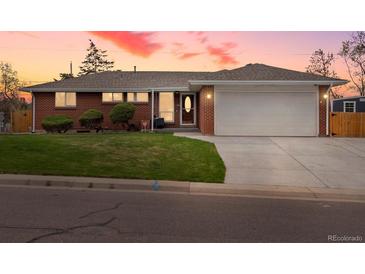 Charming brick home featuring a well-maintained lawn and an attached two-car garage at 2698 E Cresthill Ave, Centennial, CO 80121
