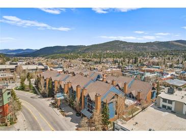 Stunning aerial view of the condos surrounded by a charming mountain town and scenic mountain views at 100 S Park Ave # E312, Breckenridge, CO 80424