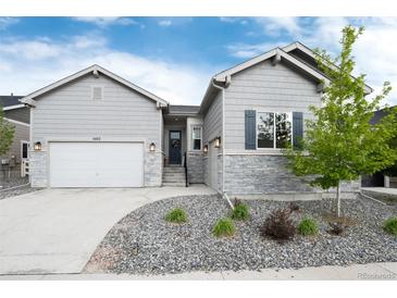 Charming single-Gathering home with manicured landscaping and a two-car garage, offering curb appeal at 5072 Silver Hare Ln, Castle Rock, CO 80104