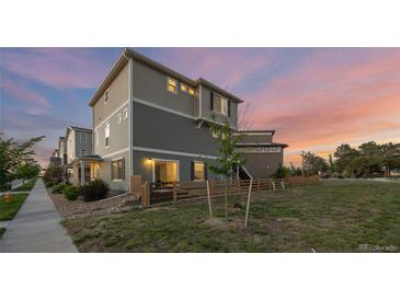Charming two-story home with landscaped yard and a modern exterior paint scheme at 10200 Xanadu St, Commerce City, CO 80022