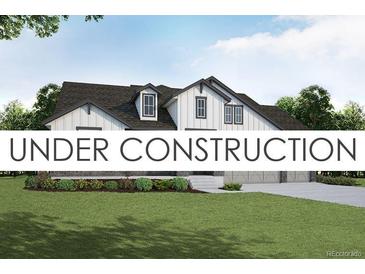 Charming two-story home with black trim, white siding, and a well-manicured front yard at 21821 E Tansy Pl, Aurora, CO 80016