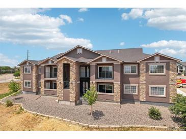 Two-story building exterior, featuring stone and stucco accents at 875 E 78Th Ave # 69, Denver, CO 80229