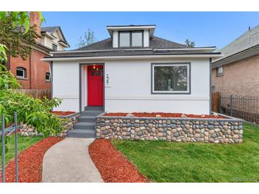 Charming home with a vibrant red door, complemented by a stone accent wall and a well-maintained front yard at 2767 W 38Th Ave, Denver, CO 80211