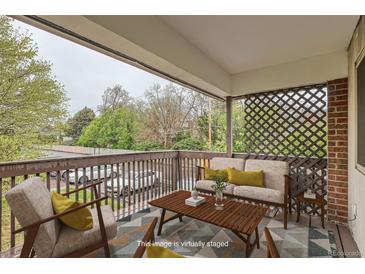 Staged patio featuring stylish outdoor seating with a view at 3663 S Sheridan Blvd # J12, Denver, CO 80235