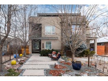 Modern two-story home featuring stone accents, walkway and chairs at 2334 Lowell Blvd, Denver, CO 80211