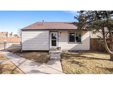 Charming single-story home featuring a well-maintained front yard and welcoming entrance at 972 S Zeno Way, Aurora, CO 80017