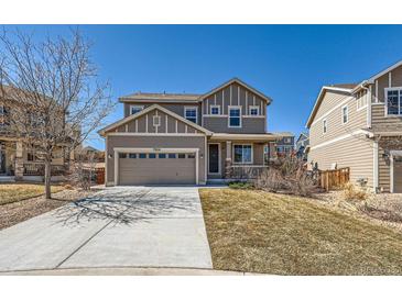 Two-story home with a two car garage, and a cozy front porch at 7506 Sabino Ln, Castle Rock, CO 80108