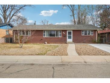 Charming brick ranch-style home with a welcoming entryway and well-maintained landscaping at 10 Merideth Ln, Longmont, CO 80501