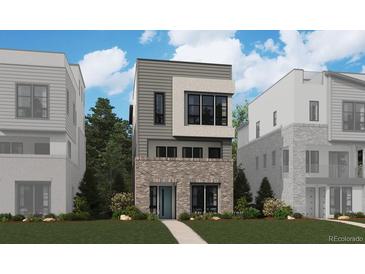Beautiful three-story home with modern architectural design and a well-manicured front lawn at 11493 E Briarwood Cir, Centennial, CO 80112