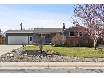 Charming single-Gathering home featuring a well-manicured lawn and mature landscaping adding to its curb appeal at 4833 S Elati St, Englewood, CO 80110