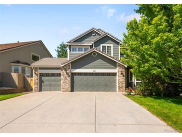 Attractive two-story home boasts a three-car garage, brick accents, and a well-maintained front lawn at 3529 Huron Peak Ave, Superior, CO 80027