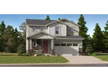 Inviting two-story home showcasing a stone-accented facade, attached two-car garage, and manicured front lawn at 7743 S Cherokee Trl, Centennial, CO 80016