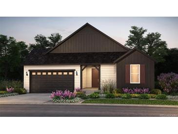 Charming single-Gathering home featuring a two-car garage and a beautifully landscaped front yard at 39574 Gwinett Cir, Elizabeth, CO 80107