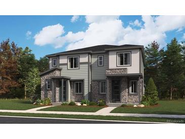 Modern two-story home featuring stone accents and a well-maintained front yard at 17005 E Alameda Pkwy, Aurora, CO 80017