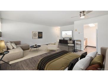 Stylishly furnished living space featuring hardwood floors and modern decor at 888 N Logan St # 2E, Denver, CO 80203