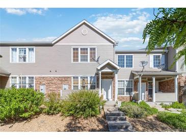Charming townhome featuring stone accents, neutral siding, and well-maintained landscaping, creating a welcoming curb appeal at 12766 Jasmine St # D, Thornton, CO 80602