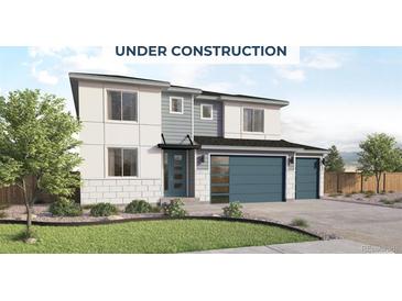 Modern two-story home with a two-car garage, gray accents, and manicured lawn under construction at 413 Clear Bell Ln, Monument, CO 80132