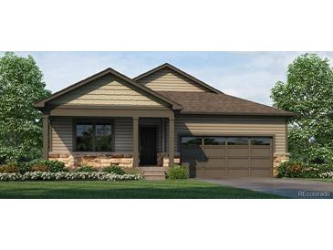 Charming single-story home with stone accents, a covered porch, well-maintained landscaping and a two-car garage at 18785 E 99Th Ave, Commerce City, CO 80022