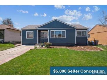 Charming single-story home featuring a well-maintained lawn and inviting curb appeal at 2285 Fulton St, Aurora, CO 80010