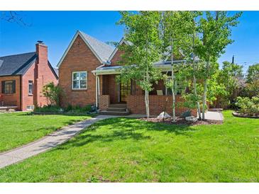 Charming brick home with well-maintained lawn and mature trees on a sunny day at 1434 Clermont St, Denver, CO 80220