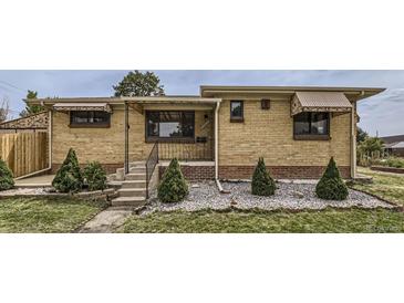 Charming brick home with well-maintained landscaping and appealing curb appeal at 10600 E 25Th Ave, Aurora, CO 80010