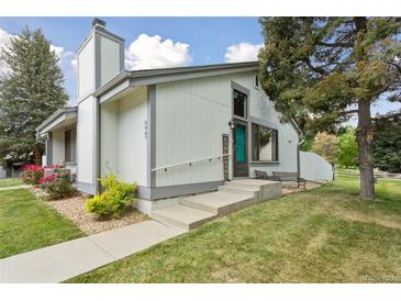 Inviting home with concrete steps, walkway, a bench, and decorative signage near the front door at 8867 Yukon St # 49, Broomfield, CO 80021