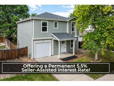 Charming two-story home with a well-maintained lawn, single car garage, and a welcoming front porch at 5225 E 100Th Dr, Thornton, CO 80229