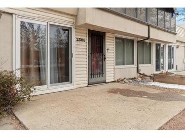 Charming condo exterior featuring a private entrance and well-maintained facade at 2306 S Troy St # A, Aurora, CO 80014