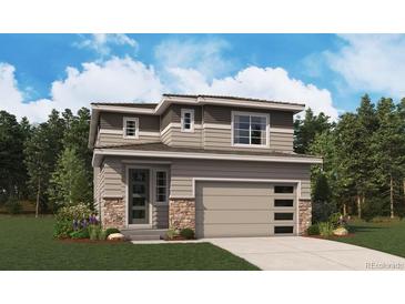 Charming two-story home with stone accents, two car garage, and a manicured front yard at 11157 Mount Emma Dr, Englewood, CO 80112