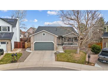 Charming home with a two-car garage, covered porch, and well-maintained front yard at 3656 E 134Th Dr, Thornton, CO 80241