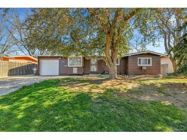 Charming single-story home with mature landscaping and a well-maintained front yard at 2580 Valley View Dr, Denver, CO 80221