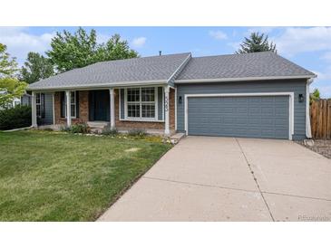 Charming single-Gathering home featuring a well-manicured front yard and two car garage at 523 E Long Ct, Littleton, CO 80122
