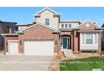 Charming two-story home with a brick exterior, an attached two-car garage, and a well-maintained lawn at 3745 Spanish Oaks Trl, Castle Rock, CO 80108