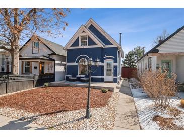 Beautiful home featuring unique architectural details, a cozy front yard, and a well-maintained exterior at 1144 S Logan St, Denver, CO 80210