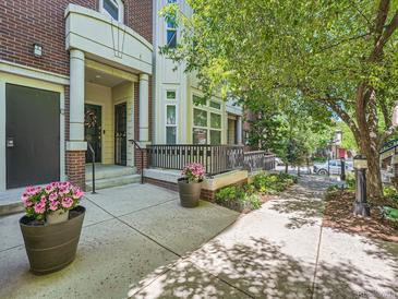 Inviting front porch with decorative planters and a well-maintained entryway at 30 Garfield St # B, Denver, CO 80206