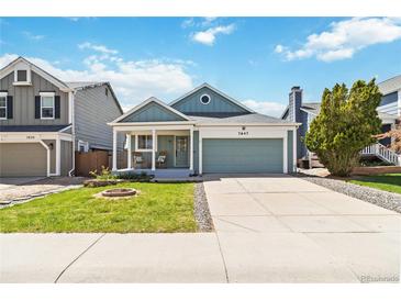 Charming single-Gathering home with a well-manicured lawn and inviting front porch at 7647 Elmwood St, Littleton, CO 80125