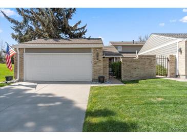 Charming single-Gathering home with a two-car garage, and well-maintained lawn at 7172 S Vine Cir, Centennial, CO 80122