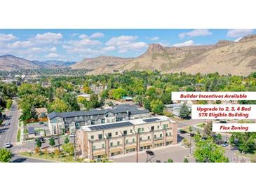 Striking multi-unit building with mountain views and solar panels, eligible for short term rental with flex zoning at 615 24Th St # 103, Golden, CO 80401