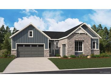 Charming exterior showcasing a blend of stone and siding, a two-car garage, and a well-manicured lawn at 8658 Pennycress Dr, Littleton, CO 80125