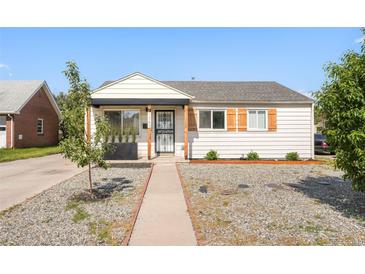 Charming home featuring a well-kept yard, stylish shutters, and a welcoming entrance, perfect for suburban living at 1749 Havana St, Aurora, CO 80010