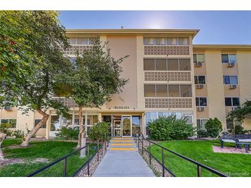 Attractive exterior of a two-story building with landscaping and walkway at 3164 S Wheeling Way # 306, Aurora, CO 80014