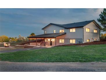 Stunning two-story home boasting a covered patio and beautifully landscaped yard, perfect for outdoor entertaining at 12628 N 3Rd St, Parker, CO 80134
