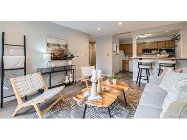 Inviting living room with open layout, stylish furnishings, and modern decor at 1008 N Corona St # 205, Denver, CO 80218